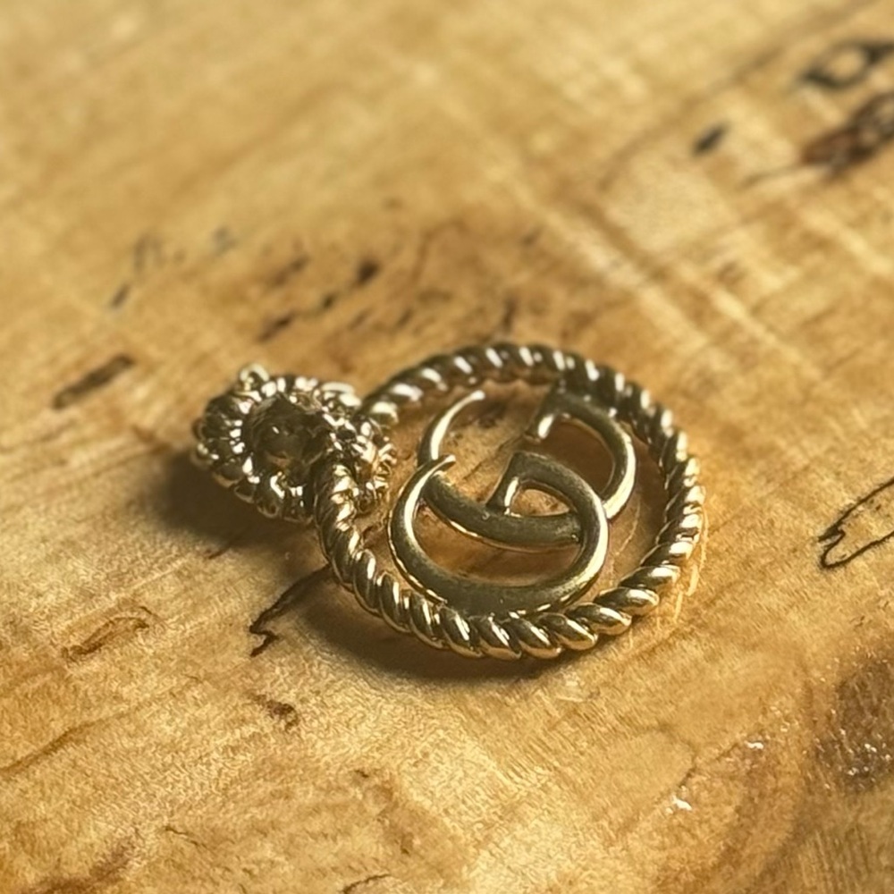40. Double G Gold Tone Lions Head Charm